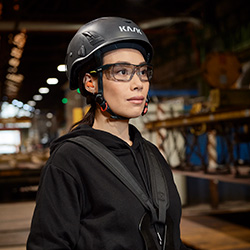 Woman working in a warehouse with Bollé Glasses