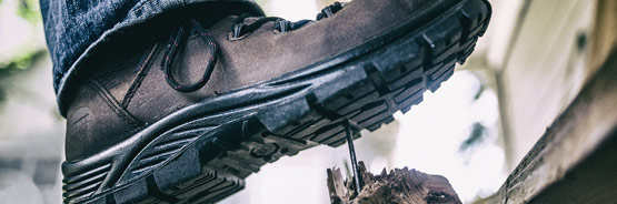 The Right Safety Boots for the Job Header Image - Boot Stepping on Nail